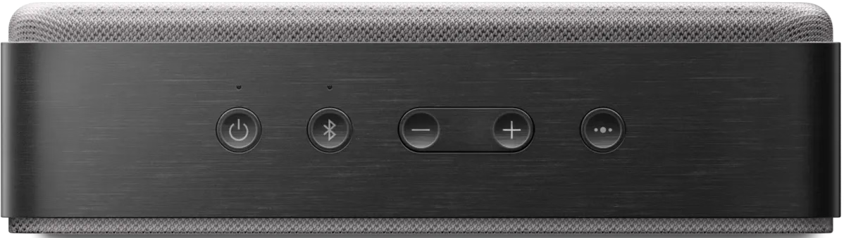 Dunkelgrauer Lautsprecher mit Tasten: Ein/Aus, Bluetooth, Lautstärke und Funktion. Oben grauer Stoff.
