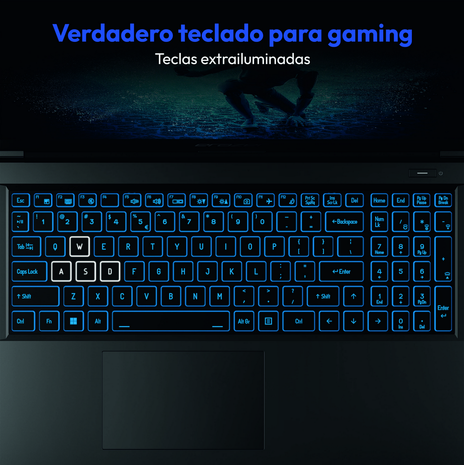 Teclado de portátil para juegos con teclas azules iluminadas. El texto superior dice 'Verdadero teclado para juegos'.