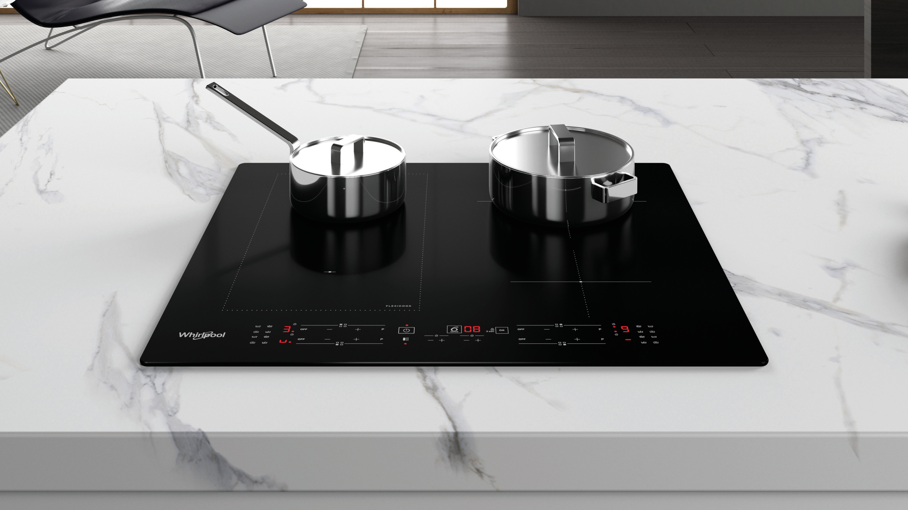 Czarna płyta indukcyjna z dwoma stalowymi garnkami na białym marmurowym blacie. Krzesło w tle.