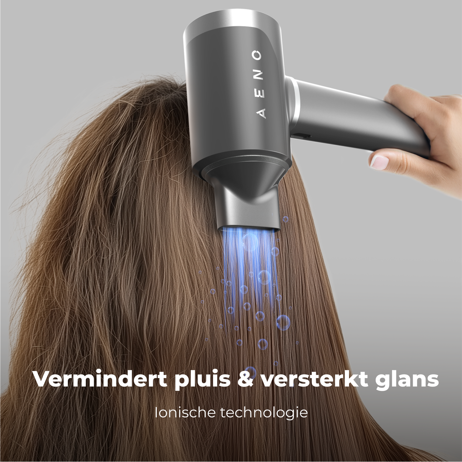 A hair dryer is used on brown hair. It emits blue light. Text: Reduces frizz & enhances shine. Ionic technology.