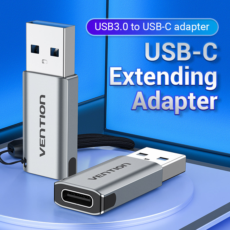 Két ezüst USB-adapter, egy álló és egy fekvő, VENTION márkával. A szöveg a következő: USB3.0-USB-C adapter, USB-C bővítő adapter.