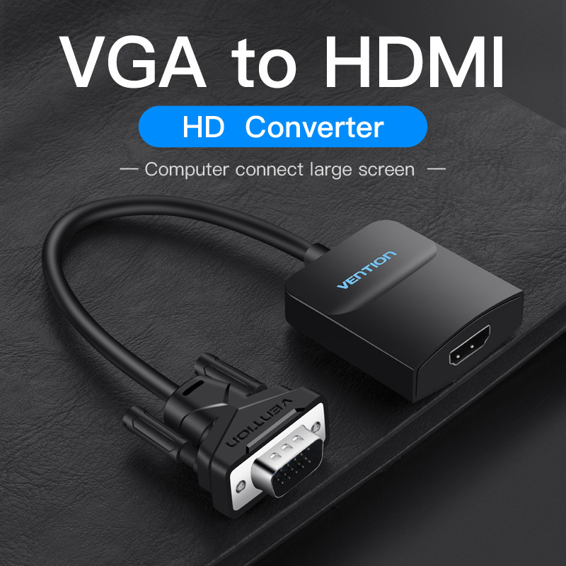 Fekete VGA-HDMI átalakító. A kábel egy VGA portot csatlakoztat egy HDMI porthoz egy fekete dobozon, sötét háttérrel.