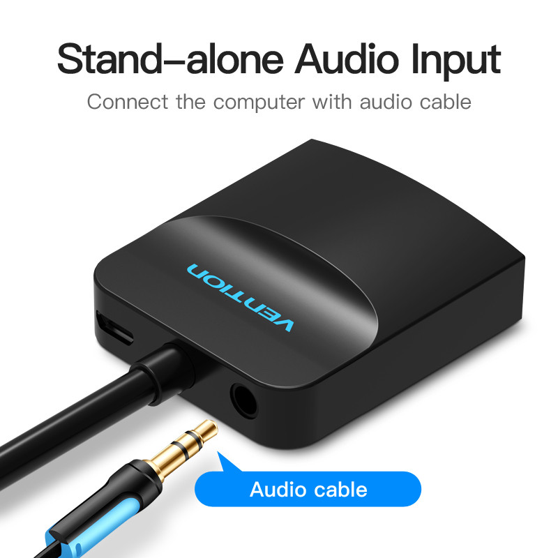 Fekete audio bemeneti eszköz csatlakoztatott audiokábellel. A szöveg azt mondja: 'Stand-alone Audio Input'.