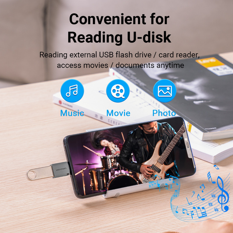 Egy telefon egy zenekart jelenít meg. USB-meghajtó csatlakozik. Zene, film és fotó ikonok felül. Szöveg: 'Kényelmes U-lemez olvasáshoz'.