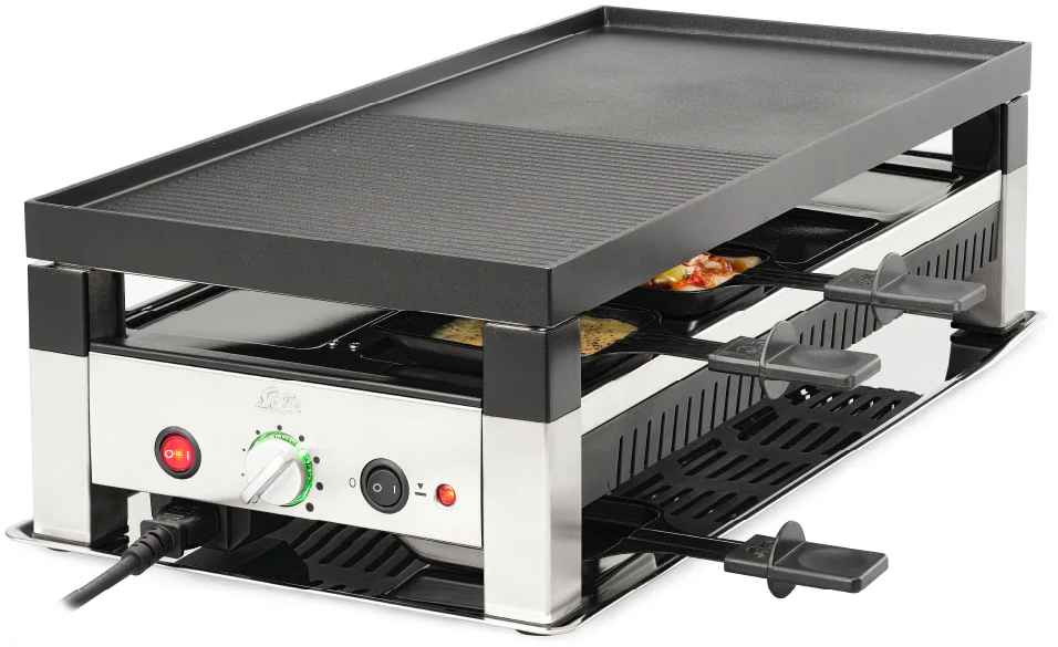Raclette-Grill mit Obergrill und unteren Pfannen. Edelstahlgehäuse. Leistungs- und Temperaturregler vorne. Schwarze Griffe.