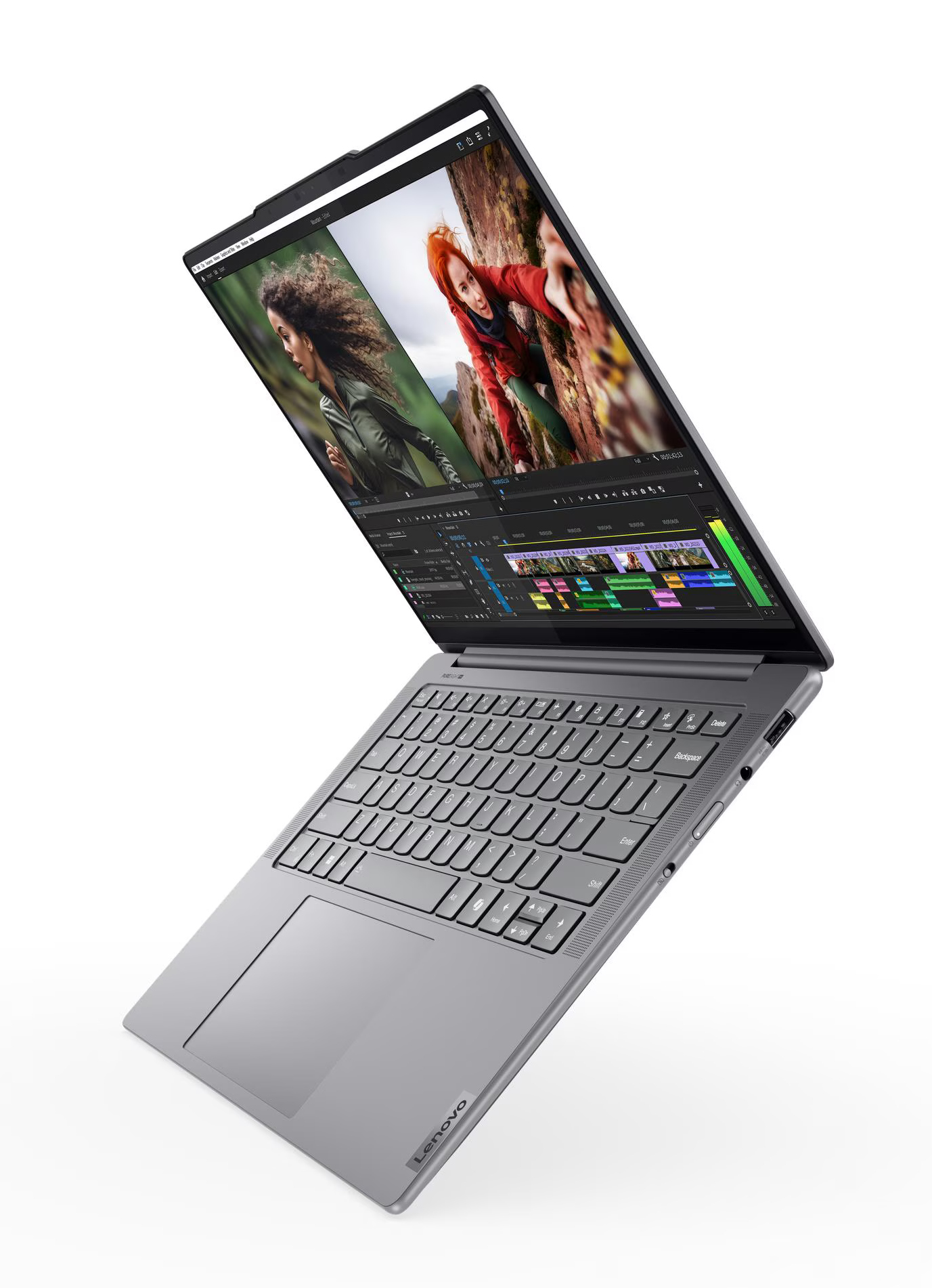 Szary laptop Lenovo jest otwarty, wyświetlając interfejs edycji wideo. Ekran pokazuje dwie osoby. Laptop jest pochylony do góry.