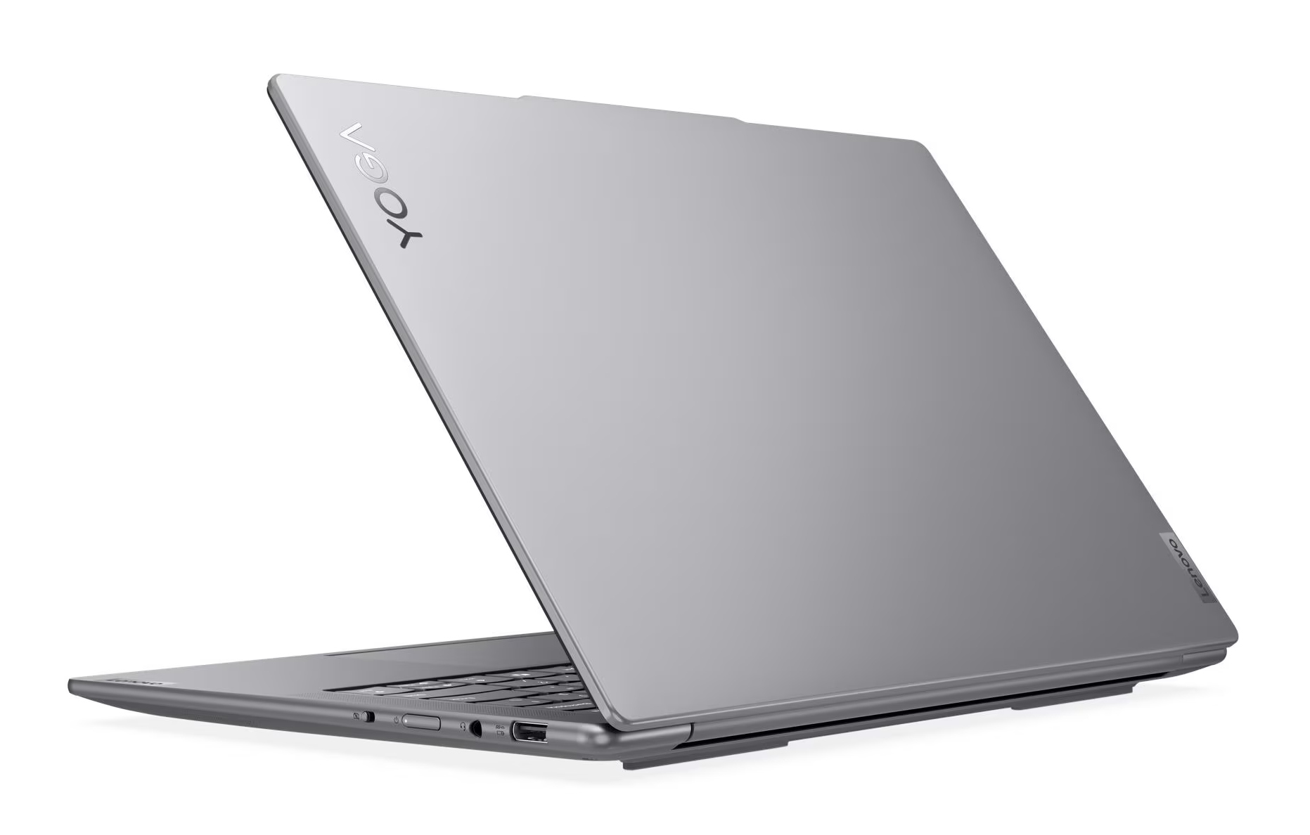 Srebrny laptop Lenovo Yoga jest otwarty. Ekran jest odchylony do tyłu, wyświetlając logo Yoga. Klawiatura jest widoczna.