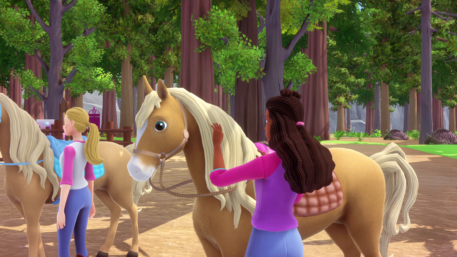 Dos chicas con caballos en un bosque. Una chica acaricia un caballo. Hay árboles en el fondo. Los caballos son de color marrón claro.