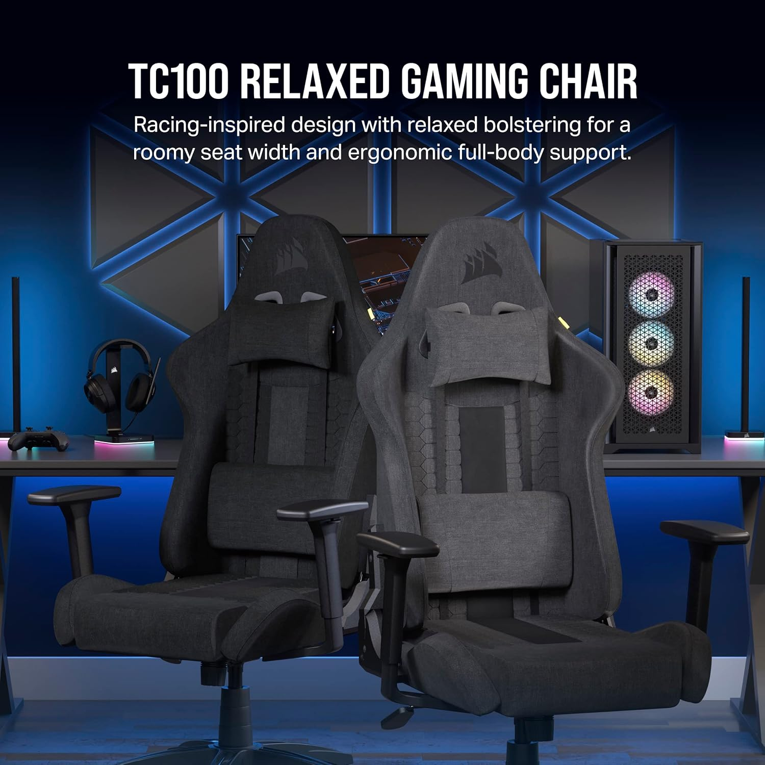 Two gray gaming chairs with headrests are in a room. A computer case with colorful lights is on the right, and a desk with gaming accessories.