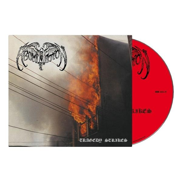 CD-Cover mit einem brennenden Gebäude. Der Bandname ist "ABOMINATION". Die CD ist rot und der Text "TRAGEDY STRIKES" ist sichtbar.