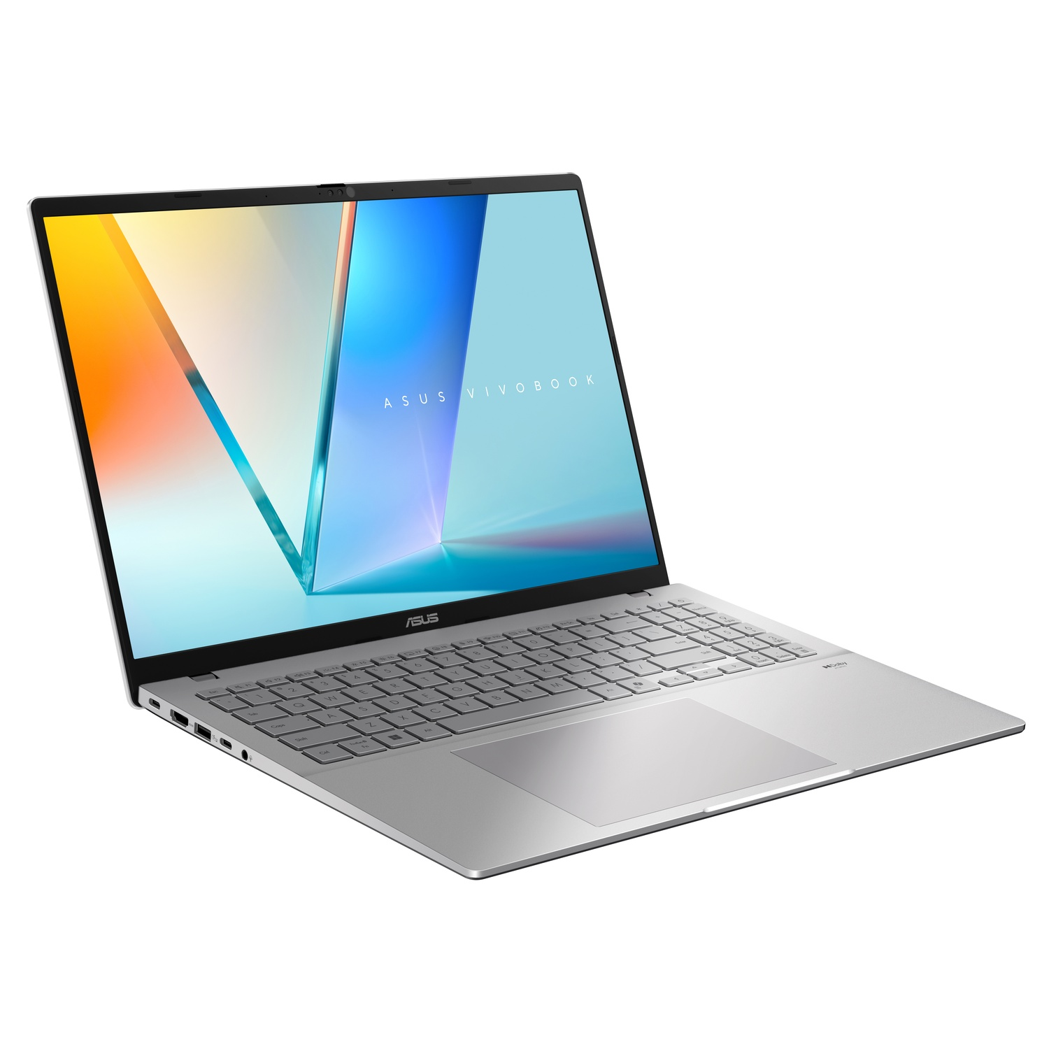 Silver ASUS Vivobook laptop open on white surface. Screen shows colorful image. Keyboard and trackpad are visible.