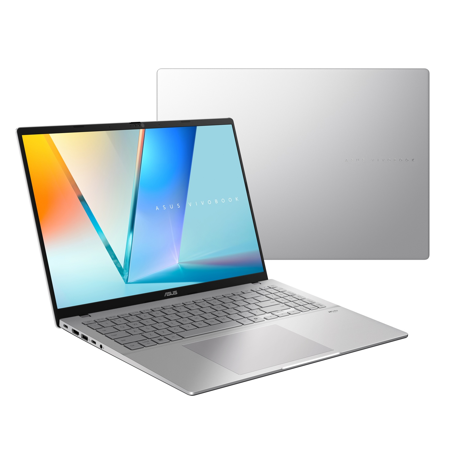 A silver ASUS Vivobook laptop is open, displaying a colorful screen. The lid is behind the laptop.
