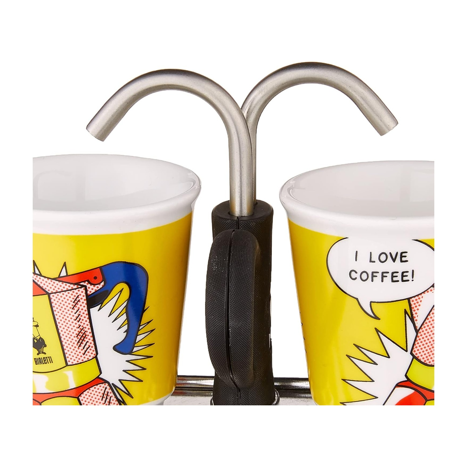 Due tazze da caffè gialle con disegni pop art e interni bianchi. Un supporto in metallo con manico nero sorregge le tazze.