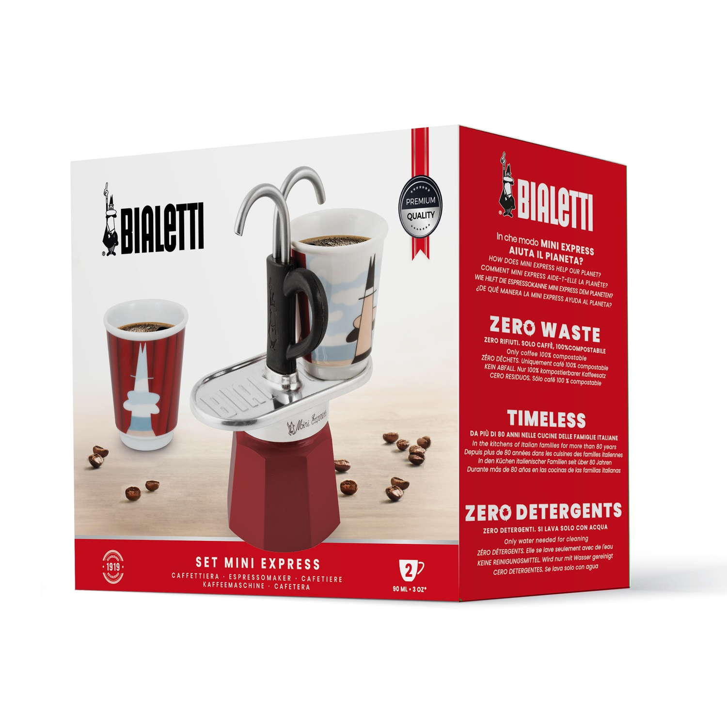 Un set Bialetti Mini Express rosso con tazza, caffettiera, chicchi di caffè e scatola con testo.