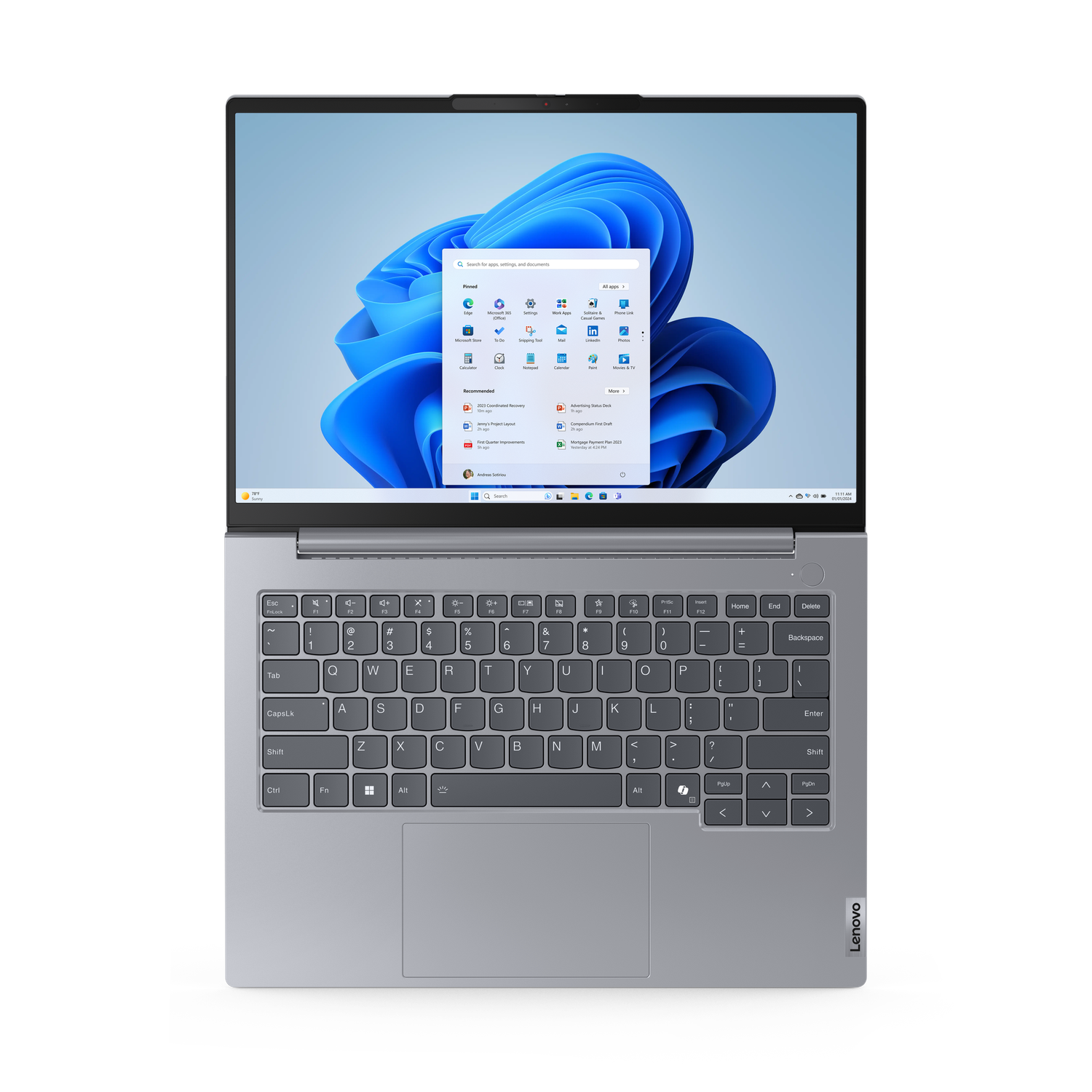 Laptop on a black background. The screen shows the Windows 11 interface. The keyboard is in the lower half of the image.