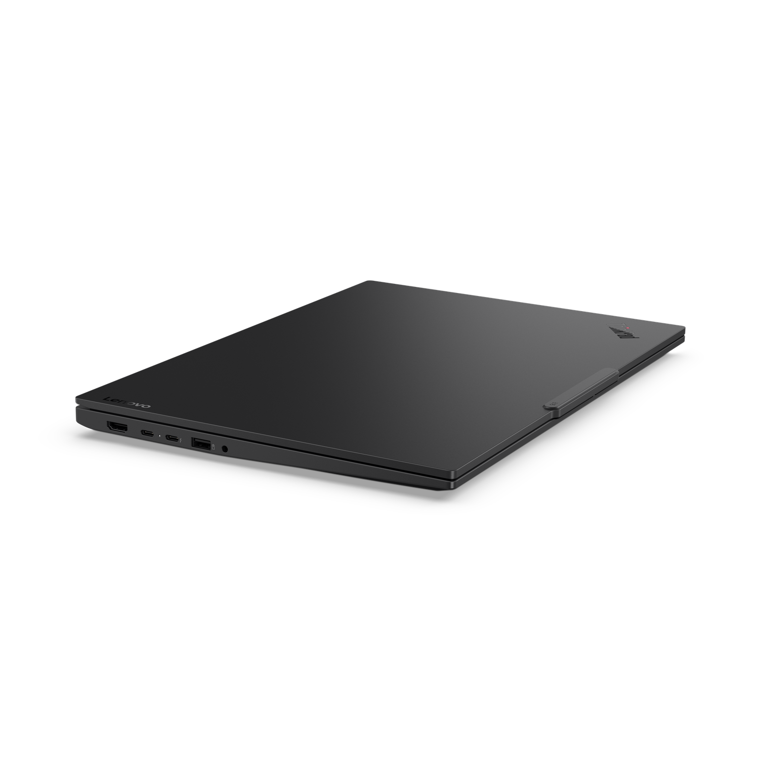 A closed black Lenovo laptop on a black surface. The laptop is slightly angled, showing some ports and the Lenovo logo.