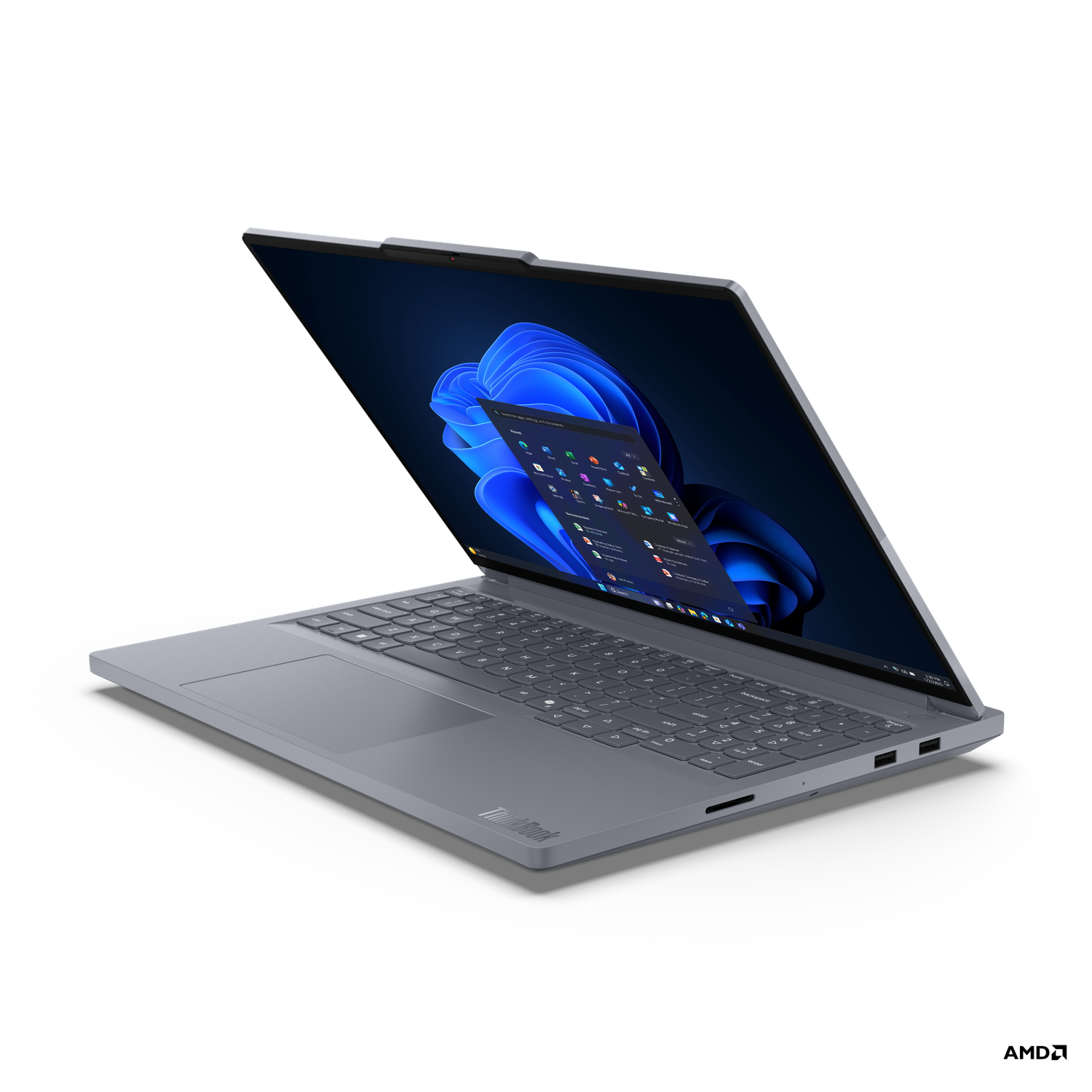A gray ThinkBook laptop is open, displaying a Windows interface. The screen shows apps and a blue, abstract background.