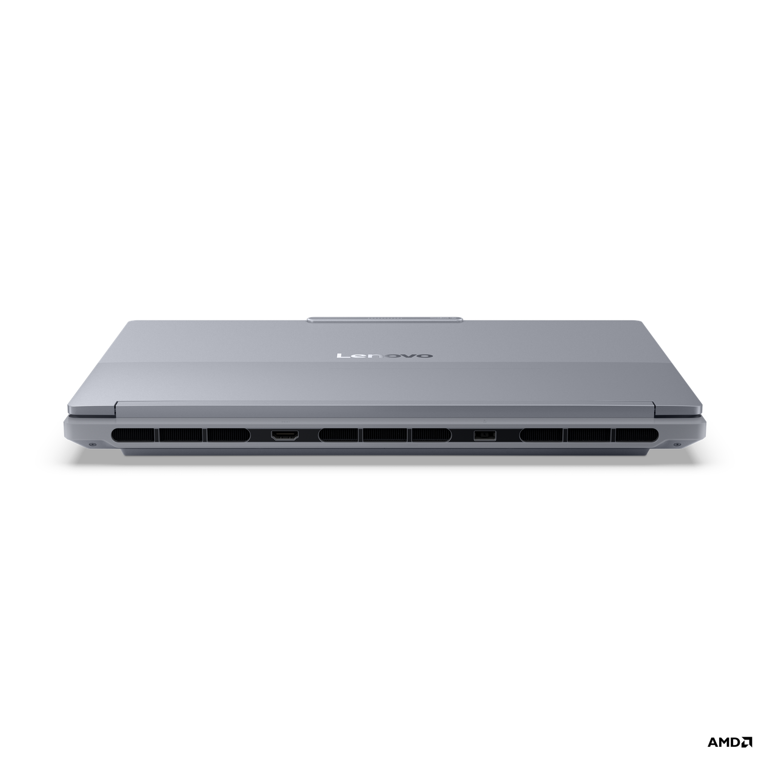 A closed gray Lenovo laptop is centered on a black background. The laptop's ports and vents are visible. The Lenovo logo is centered.