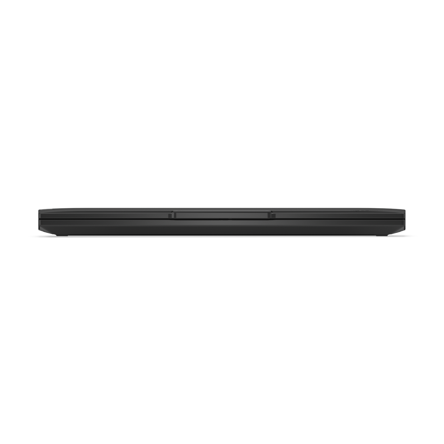 A closed, black laptop is seen from a top-down perspective. The screen is not visible. The background is black.