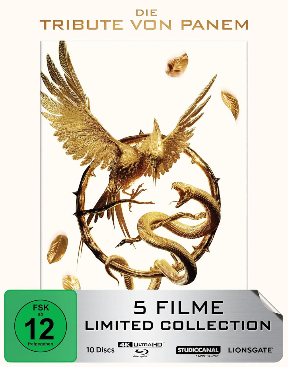 Goldener Vogel mit ausgebreiteten Flügeln und Schlange auf einem dornigen Ring. Goldene Blätter schweben herum. Der Text oben lautet 'Die Tribute von Panem'.
