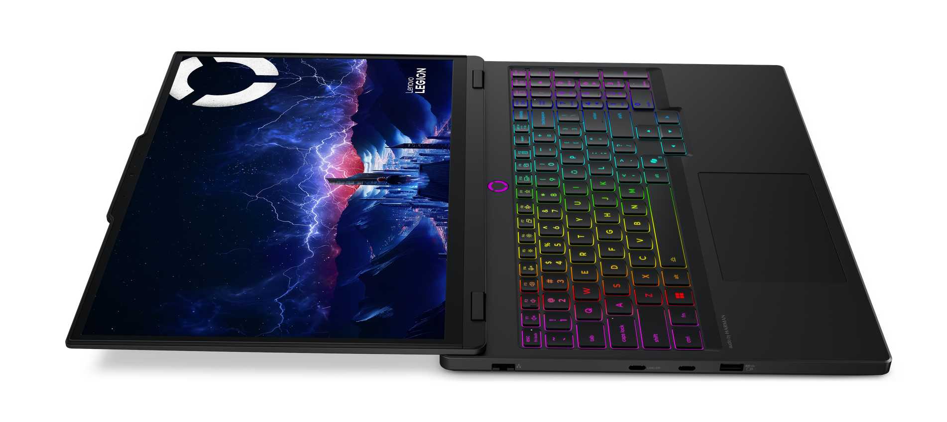 Czarny laptop Lenovo Legion z podświetlaną na tęczowo klawiaturą i ekranem z burzą nad miastem.