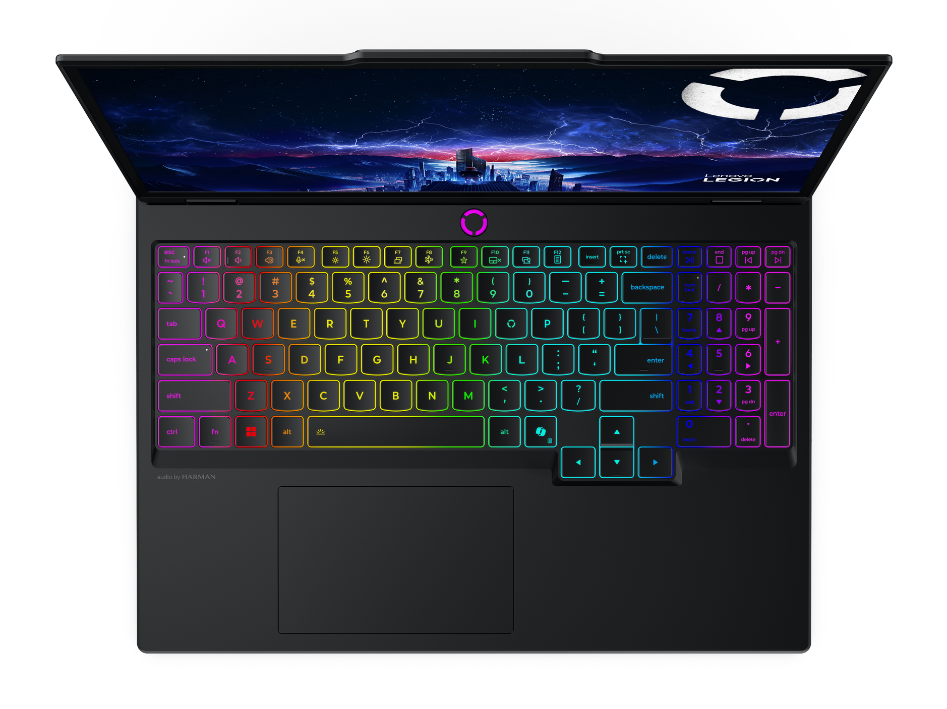 Czarny laptop z podświetlaną klawiaturą. Ekran wyświetla nocne niebo z sylwetką miasta. Logo Lenovo Legion na górze.