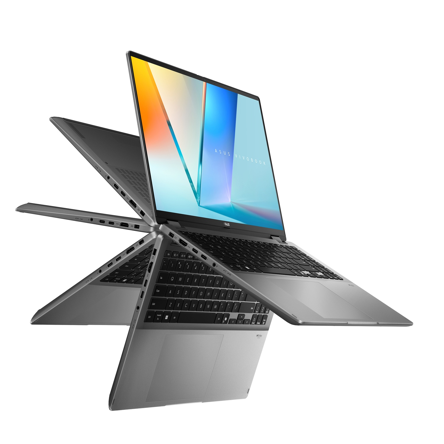 Silver ASUS Vivobook laptop. The screen displays colorful graphics. It is open with multiple viewing angles against a white background.