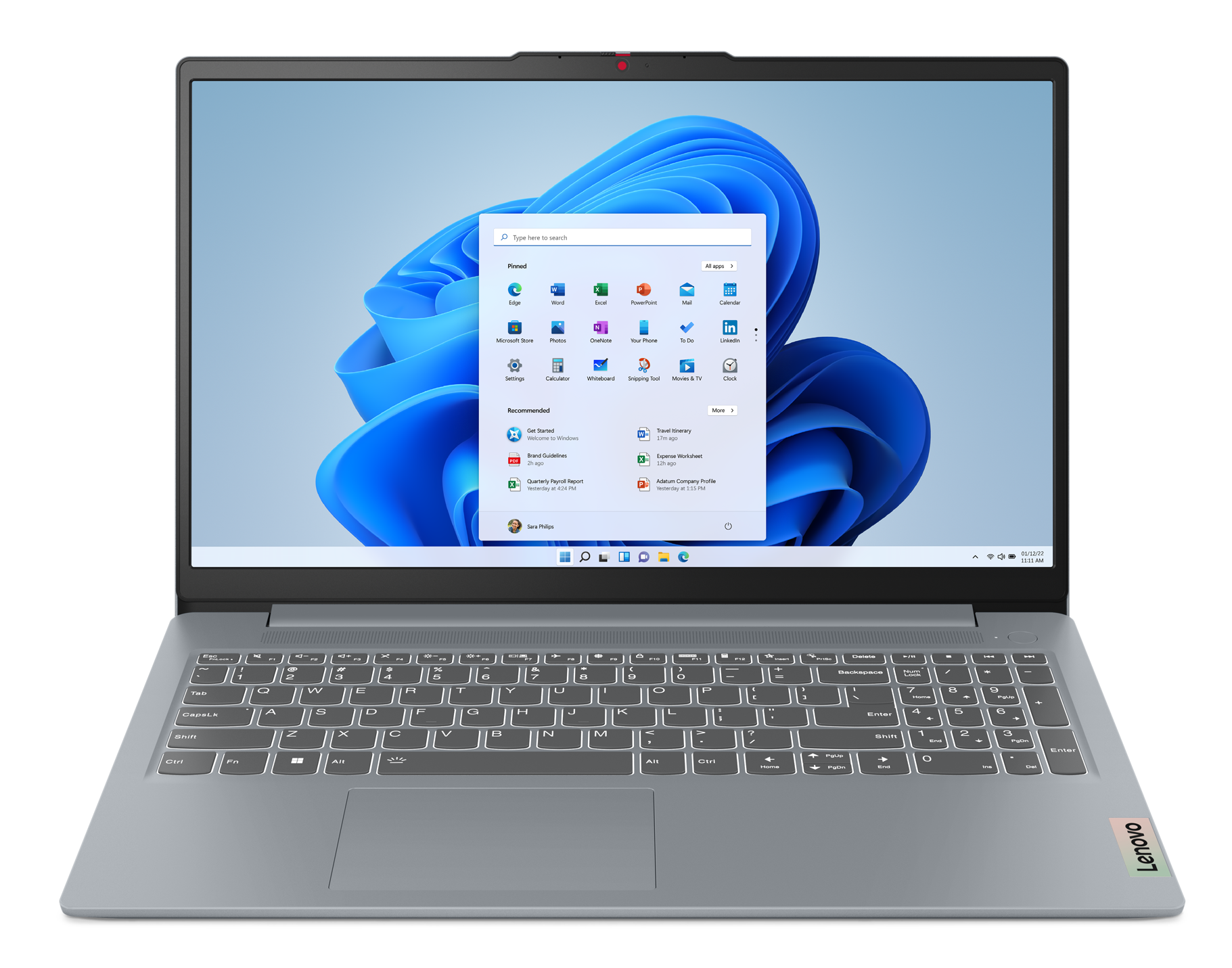 Laptop Lenovo wyświetla ekran startowy Windows 11. Klawiatura jest szara. Ekran pokazuje ikony aplikacji i widżety.