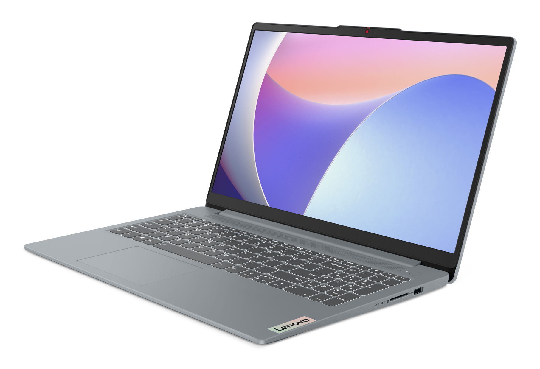 Szary laptop Lenovo jest otwarty, wyświetlając kolorowy ekran. Klawiatura jest widoczna, a tło jest czarne.