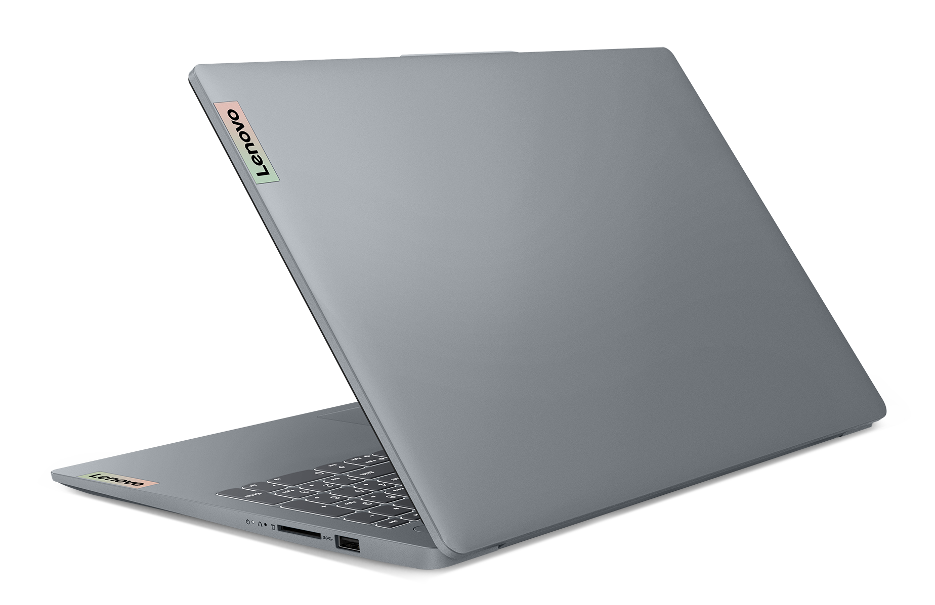 Szary laptop Lenovo, lekko otwarty, na czarnym tle. Klawiatura jest widoczna, a logo Lenovo znajduje się na pokrywie.