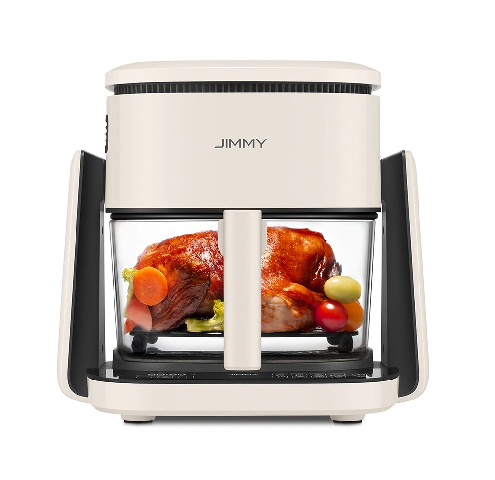 Biała i czarna frytkownica powietrzna JIMMY z pieczonym kurczakiem w środku. Widoczne są również warzywa, takie jak marchew i pomidory.