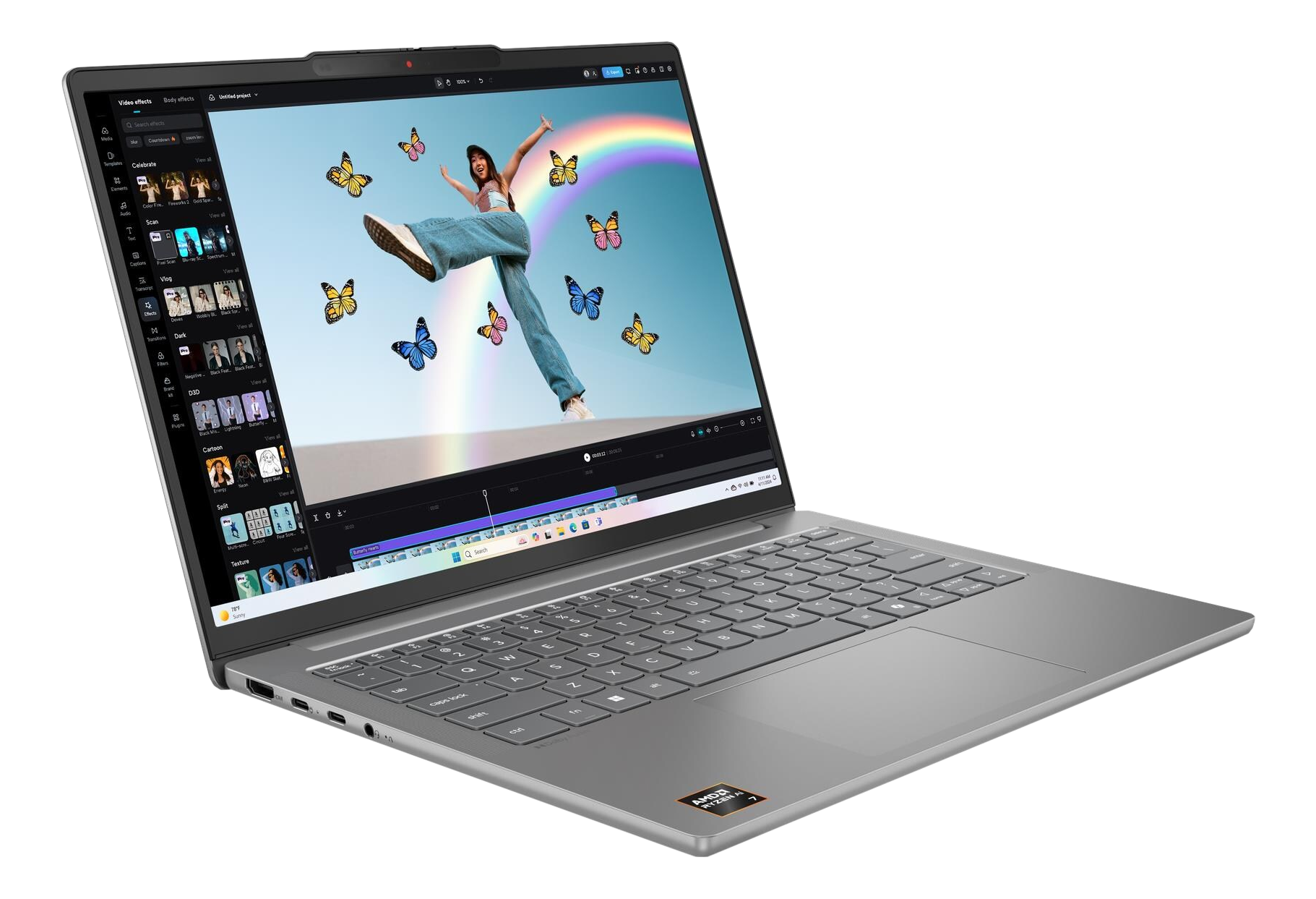 Laptop mit Videobearbeitungssoftware. Eine Person springt im Video mit Schmetterlingen und einem Regenbogen. Der Laptop ist offen, angewinkelt und silber.