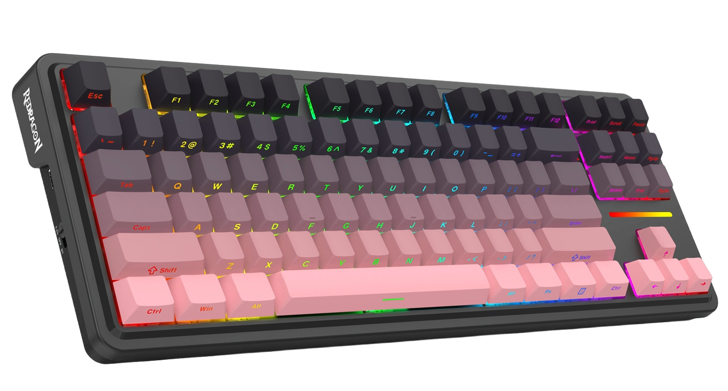 Klawiatura mechaniczna z gradientem. Klawisze są czarne, fioletowe i różowe, z podświetleniem RGB.