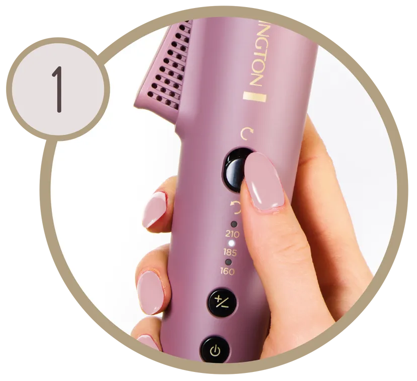 Ręka reguluje fioletową stylizator do włosów. Stylizator ma ustawienia temperatury i przycisk zasilania. Paznokcie są pomalowane na różowo.