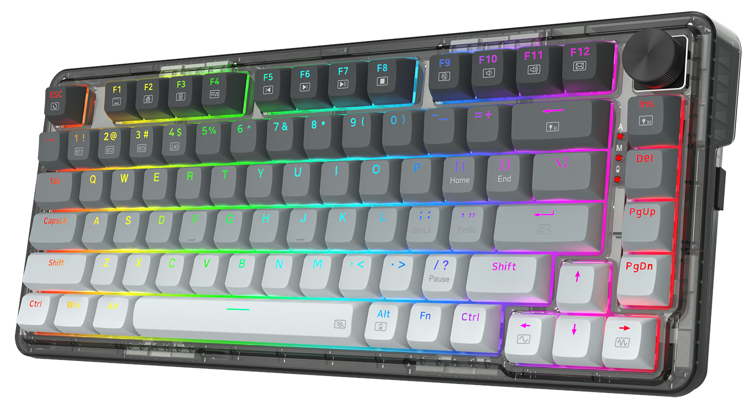 Przezroczysta klawiatura mechaniczna z szarymi nakładkami na klawisze i wielokolorowym podświetleniem LED. Zawiera pokrętło głośności i klawisze funkcyjne.