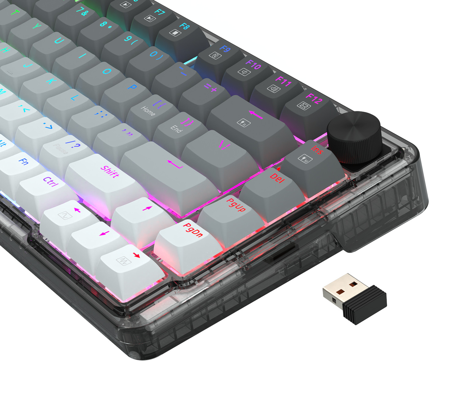 Zbliżenie klawiatury mechanicznej z szarymi, białymi i czarnymi klawiszami. Obok znajduje się odbiornik USB.
