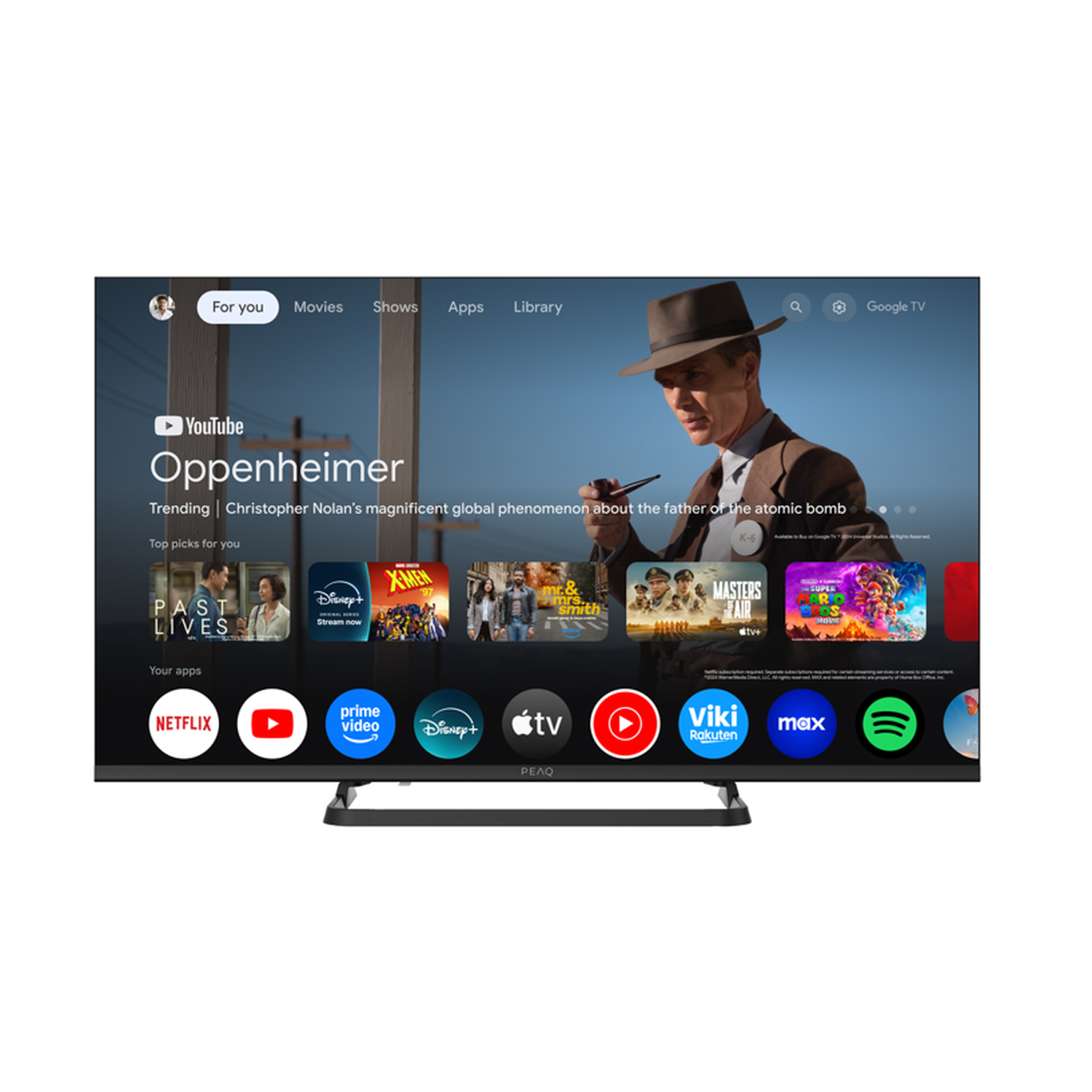 A TV shows Oppenheimer on screen. Apps like Netflix and Disney+ are displayed. The TV is black and has a silver stand.