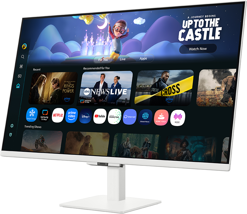Egy fehér monitor, amely egy felhasználói felületet jelenít meg, alkalmazásikonokkal és az "UP TO THE CASTLE" szöveggel. Egy rajzfilmfigura is látható.