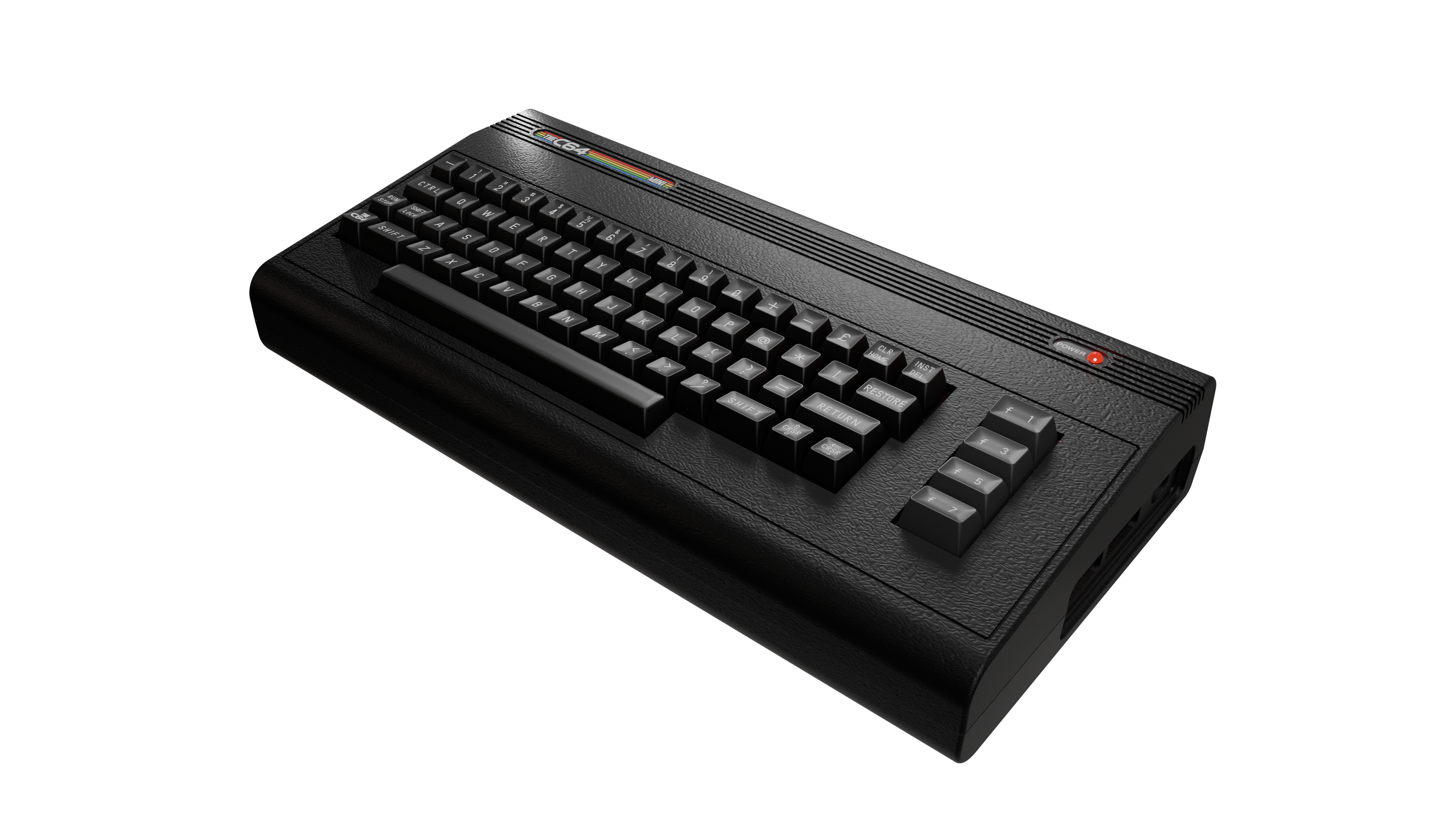 Ein schwarzer C64-Computer auf einer schwarzen Oberfläche. Die Tastatur ist sichtbar. Die Betriebsanzeige leuchtet.