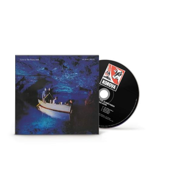 Albumcover von Echo & The Bunnymen's 'Ocean Rain' mit einem Boot auf einem See und einer CD.