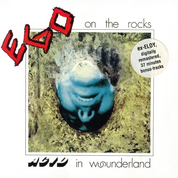 Albumcover mit blauem Gesicht, rotem "Ego"-Text und dem Titel "Acid in Wonderland". Enthält einen Aufkleber: ex-ELOY, remastered, Bonustracks.