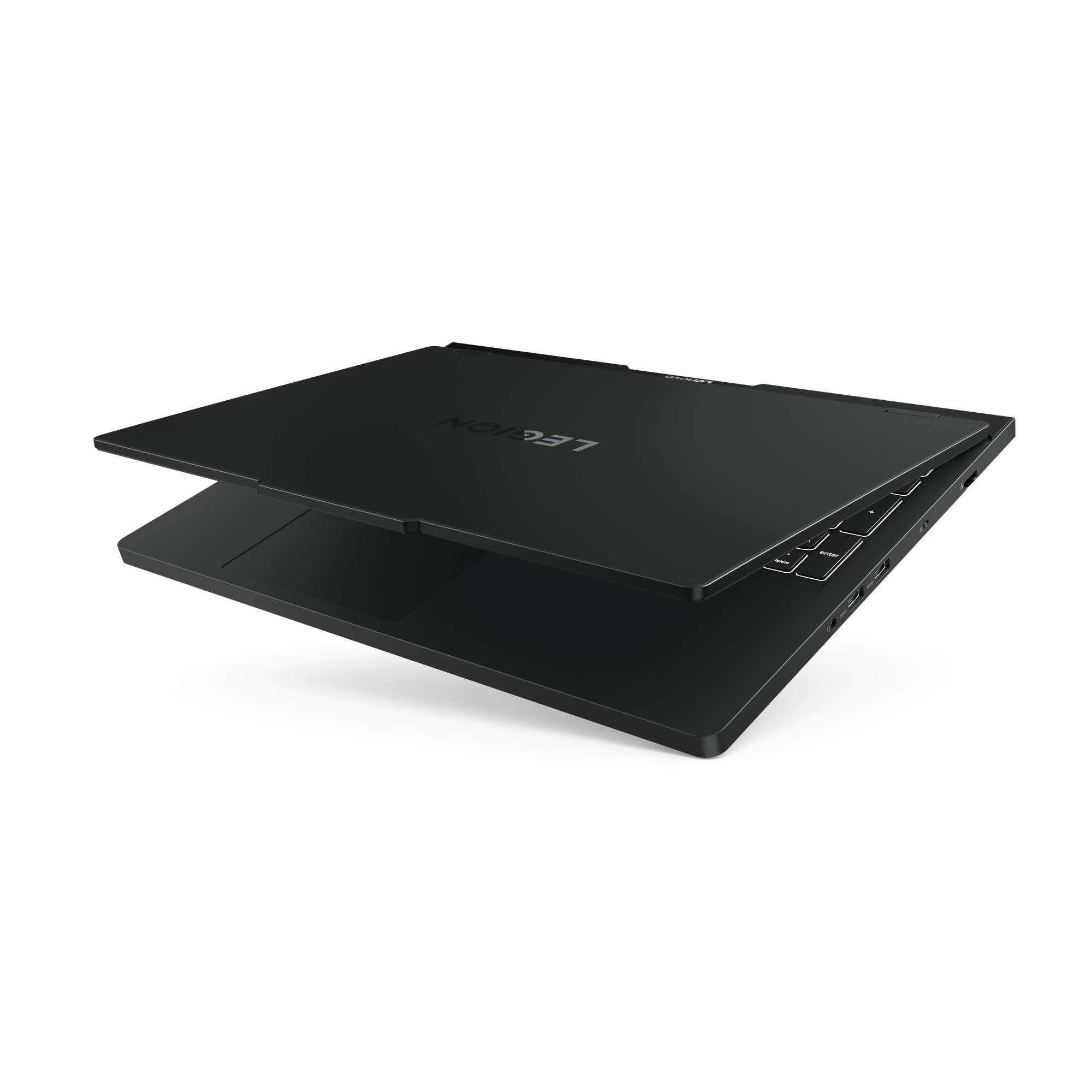 Ein schwarzer Laptop ist geöffnet und zeigt Tastatur und Bildschirm. Das Wort 'LEGION' ist sichtbar.