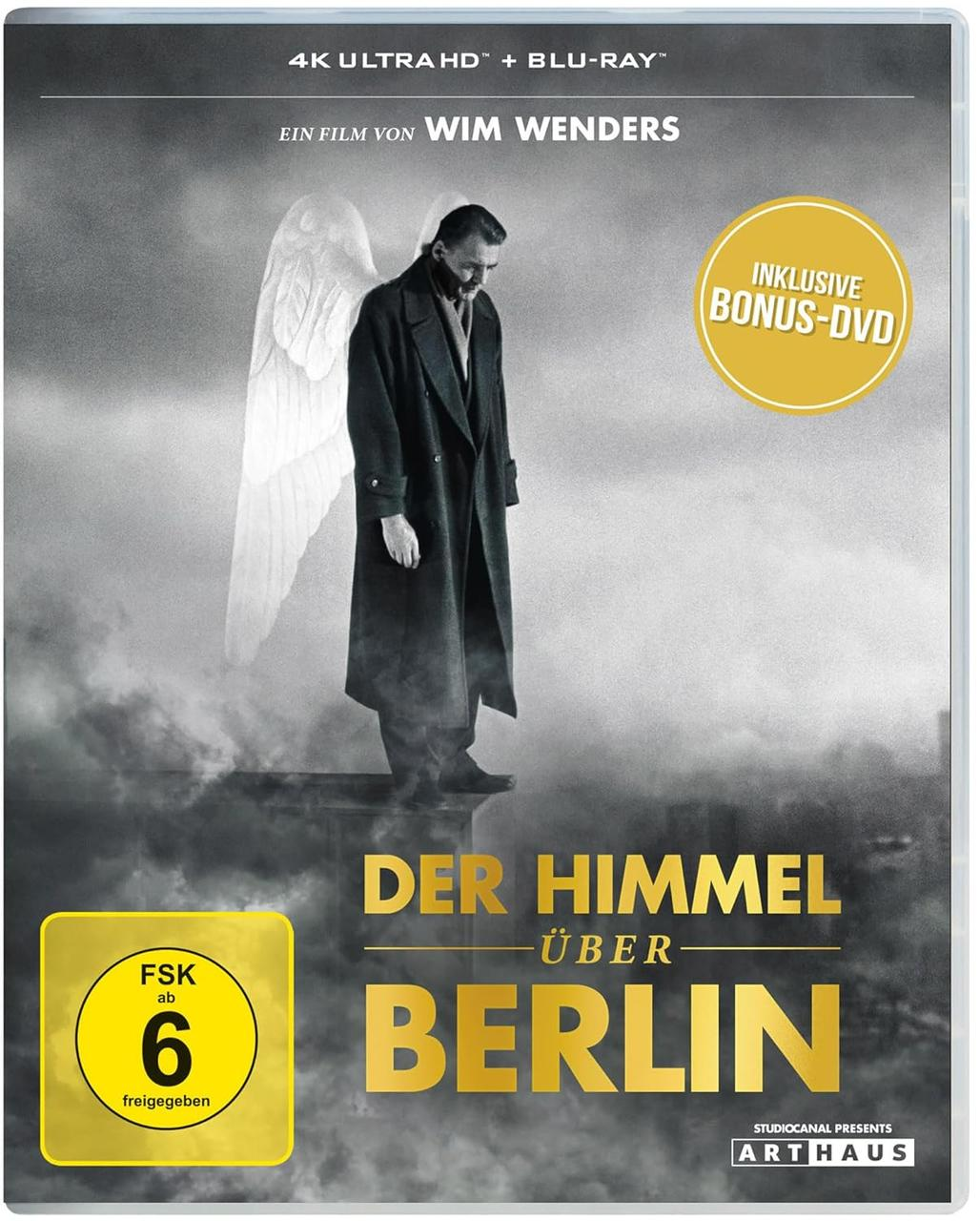 DVD-Cover für 'Der Himmel über Berlin'. Ein Engel steht auf einem Gebäude. Der Titel ist auf Deutsch. Ein gelber Aufkleber zeigt die Altersfreigabe.