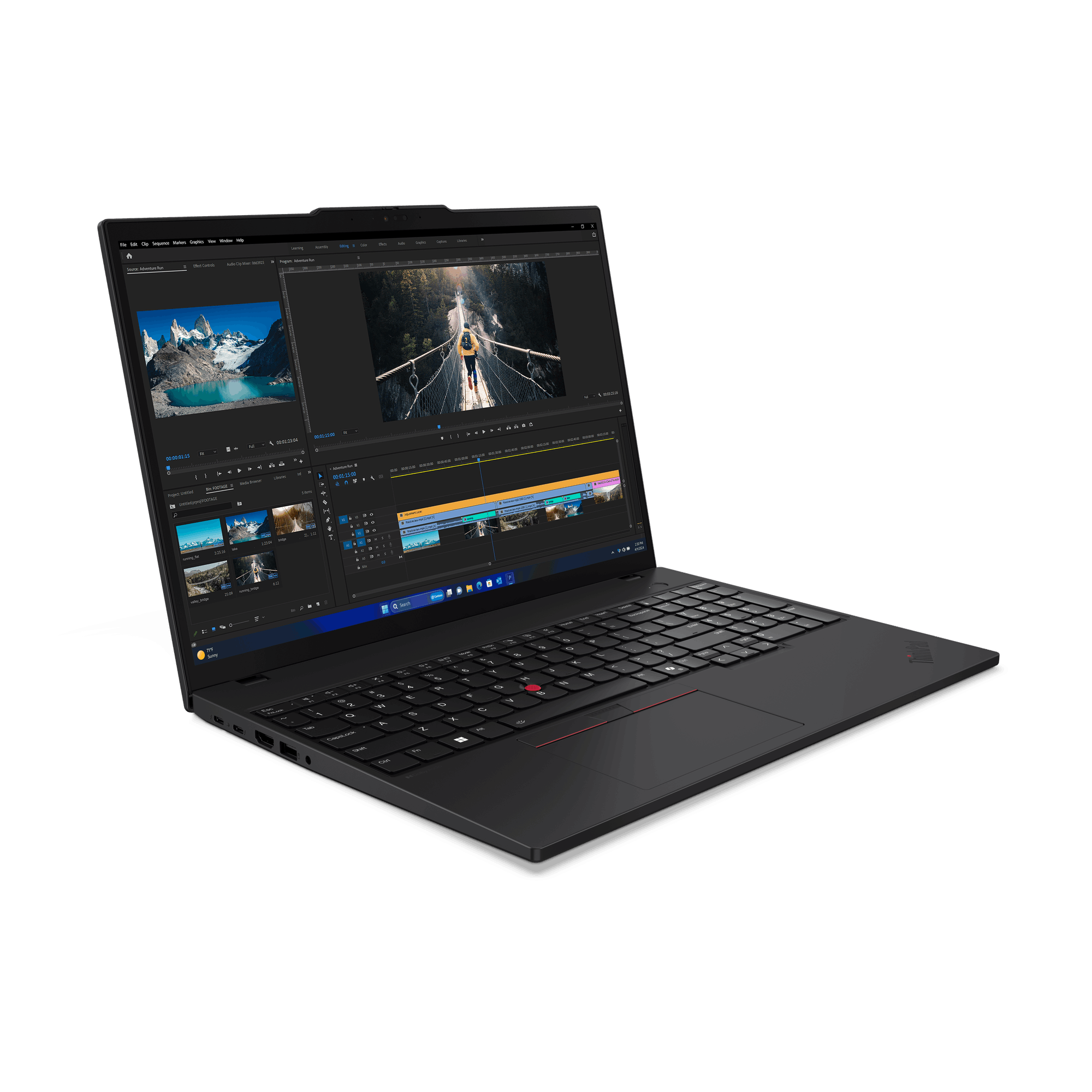 Un portátil negro muestra un software de edición de vídeo. La pantalla muestra un paisaje y una persona en un puente.