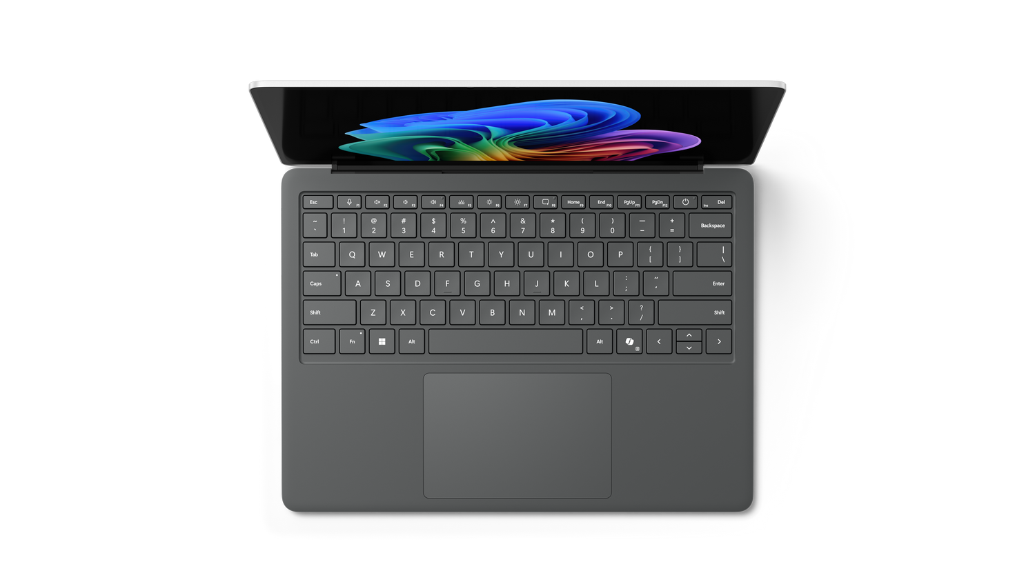 Vista superior de un portátil gris con una imagen abstracta multicolor en la pantalla. El teclado es visible y el portátil está abierto.