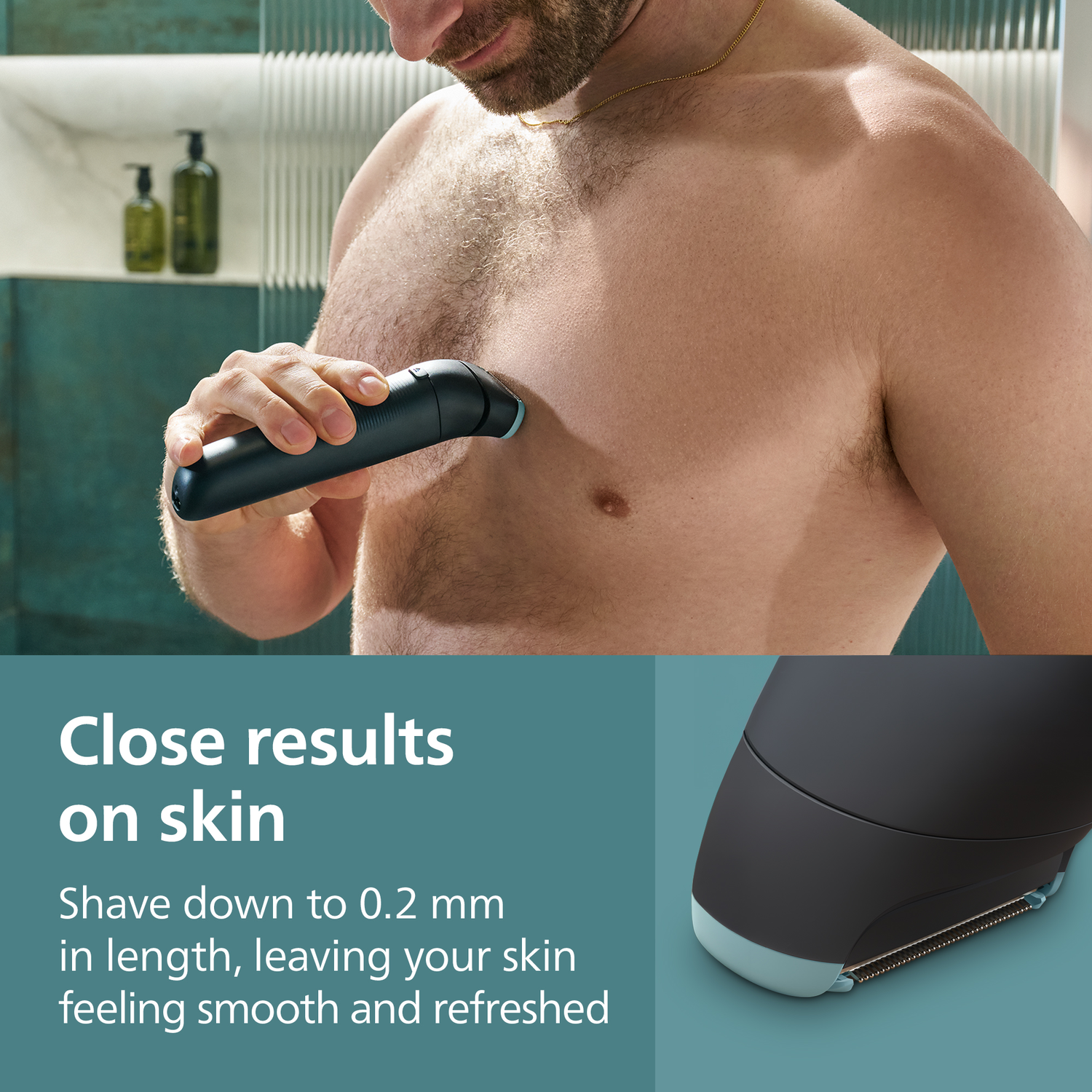 A man shaves his chest with a black and teal electric shaver. Background shows a bathroom with green bottles.