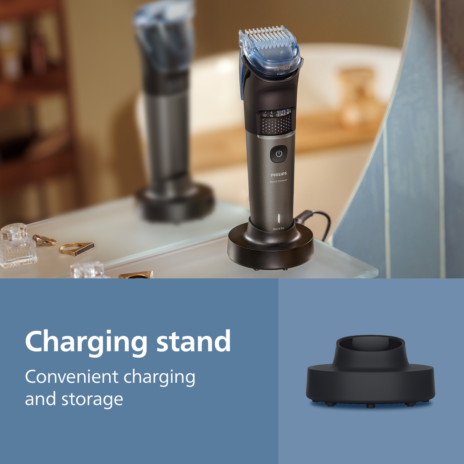A Philips beard trimmer on its charging stand. The trimmer is black and gray with a blue trimming head. The stand is black.
