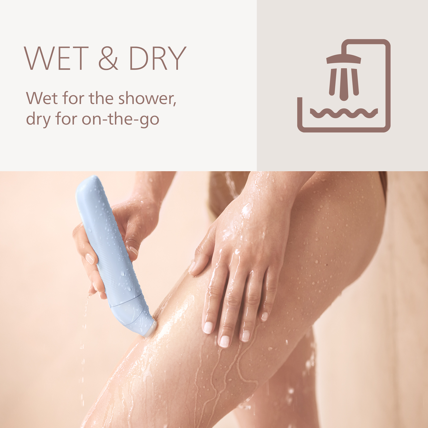 A person using a blue device on their leg in the shower. The image shows wet skin and the device in action.