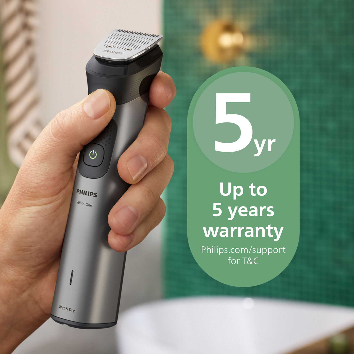A hand holds a Philips trimmer. A green circle states a 5-year warranty. The background is a bathroom setting with green tiles.