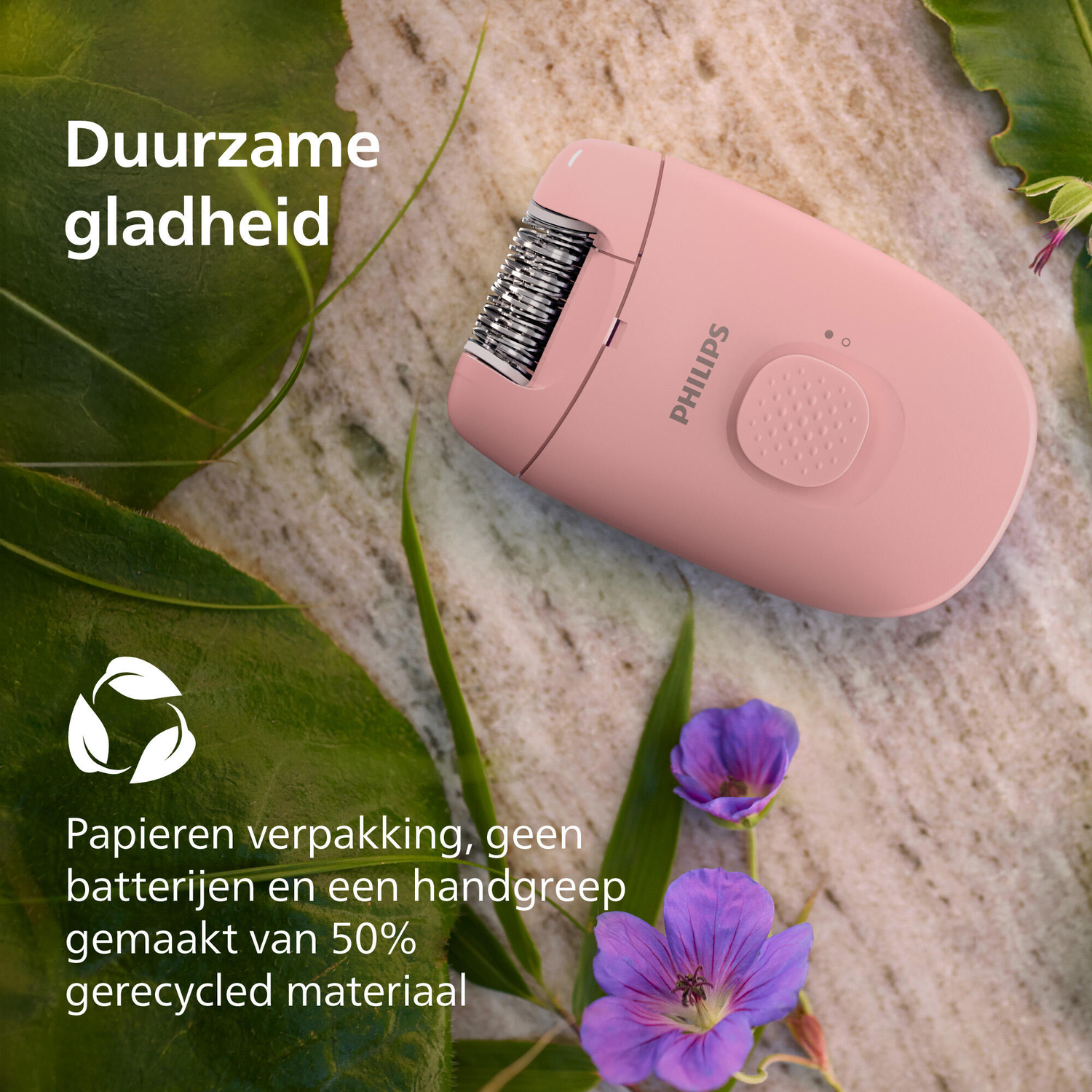 Een roze Philips epilator op steen, bladeren en bloemen. De tekst benadrukt duurzame kenmerken.